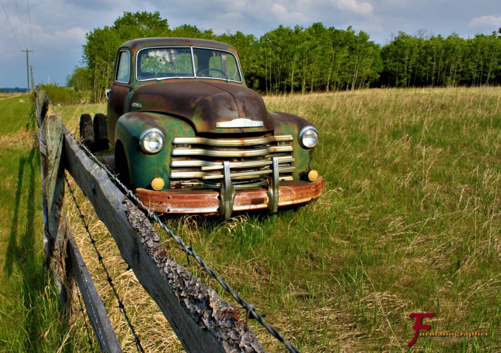 logo on truck with wire fence